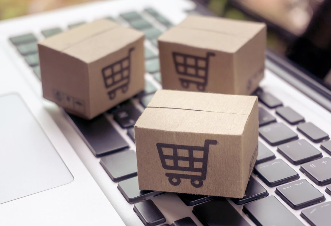 Online shopping - Paper cartons or parcel with a shopping ca